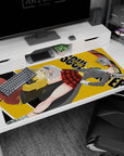 Maka in gray blazer and green tie beside Soul in yellow hoodie on an anime desk pad 40x20 inches.