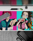 Anime desk pad 40x20 inches featuring Tanjiro in turquoise checkers and Nezuko with bubble tea on vibrant neon background.