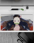 Nezuko anime mouse pad featuring her serene gaze, flowing black hair with red tips on a 32x16 inch surface.