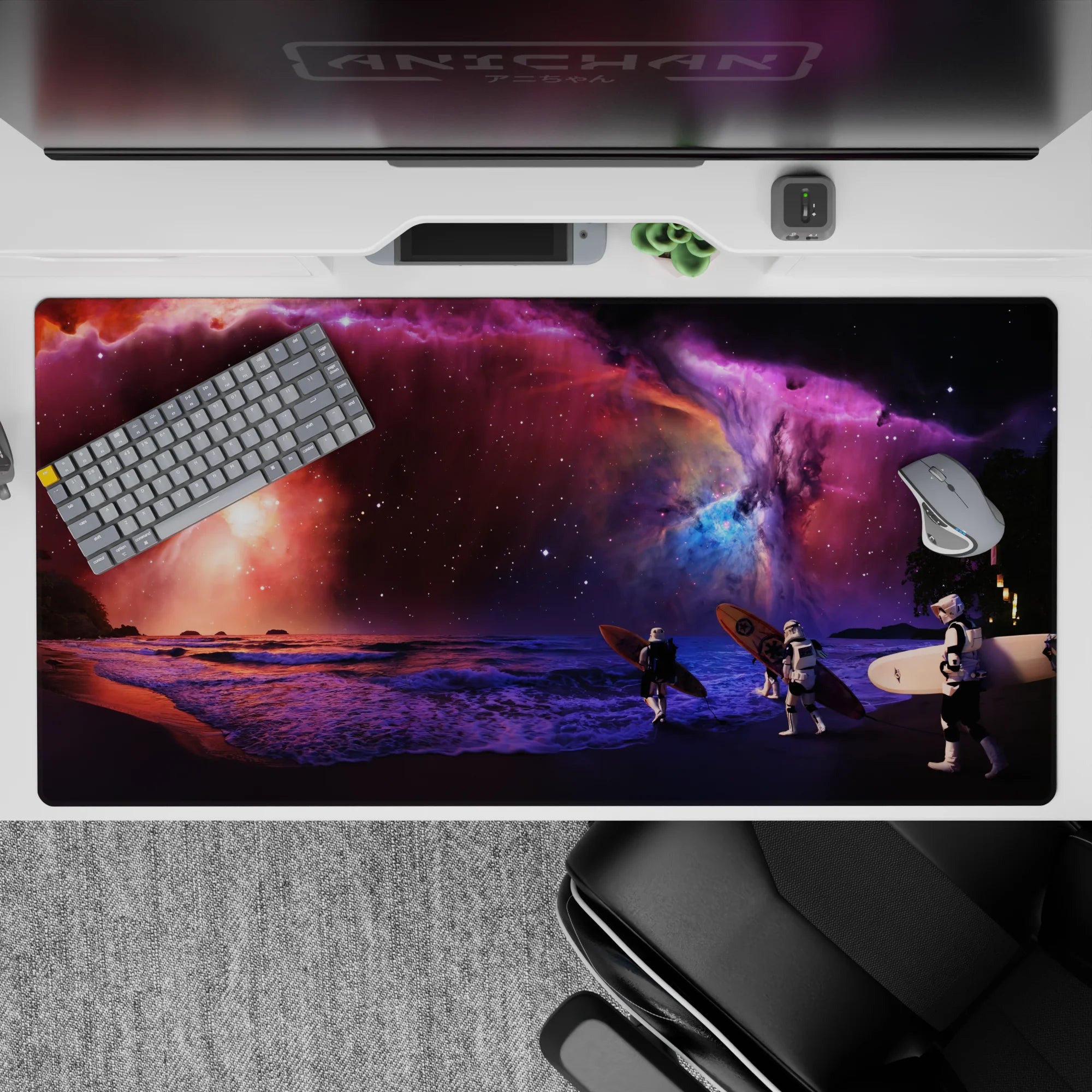 Galaxy-themed desk pad 40x20 inches with purple nebula clouds, blue sparks, and pink horizon glow.