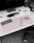 36x16 inches anime desk pad showing a girl hugging a calm orange-haired boy, both smiling on a pink scene.