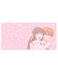 32x16 inches anime mouse pad with laughing couple hug, blush pink background and floating doodles.