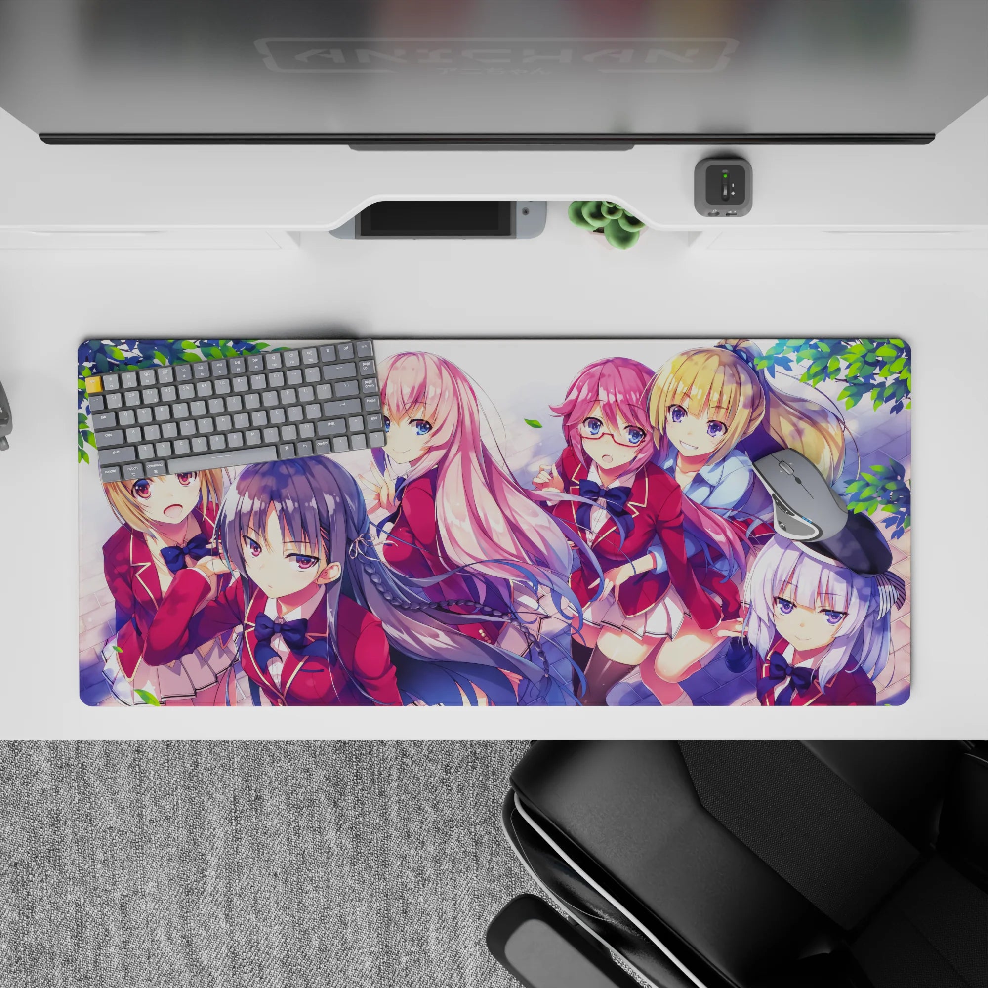 36x16 inches anime desk pad in soft pink, cherry red blazers, navy hair, and bright sky highlights.