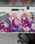 Anime girl mouse pad 40x20 inches in soft pinks, cherry red blazers, navy hair, bright sky tones.