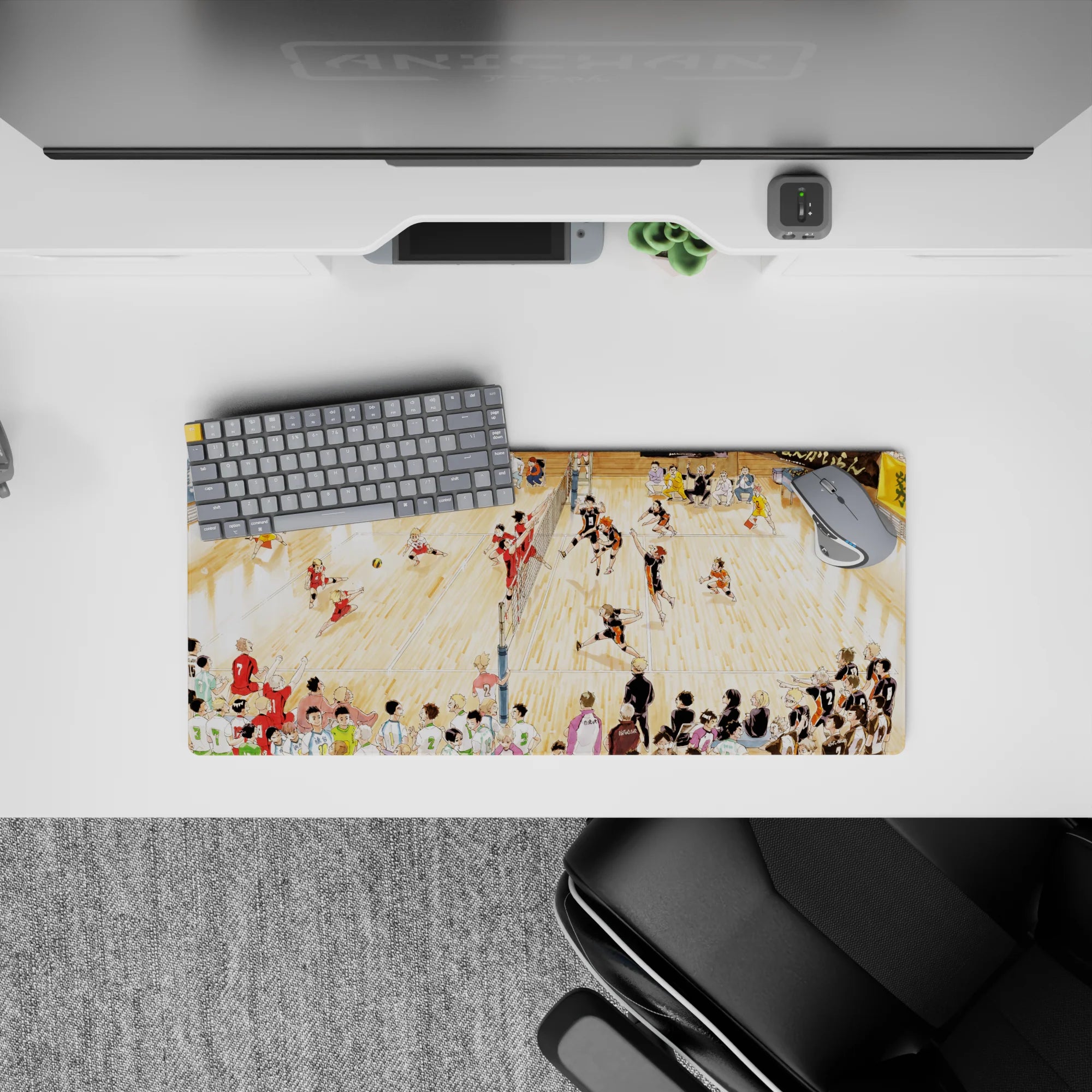 28x12 inches anime mouse pad in warm gym light, black-orange vs red jerseys, loud tournament vibe on wood court.