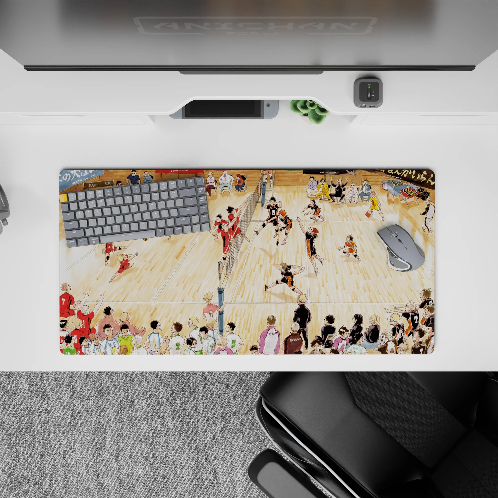 32x16 inches anime mouse pad in warm gym light, black-orange vs red jerseys, loud tournament vibe.