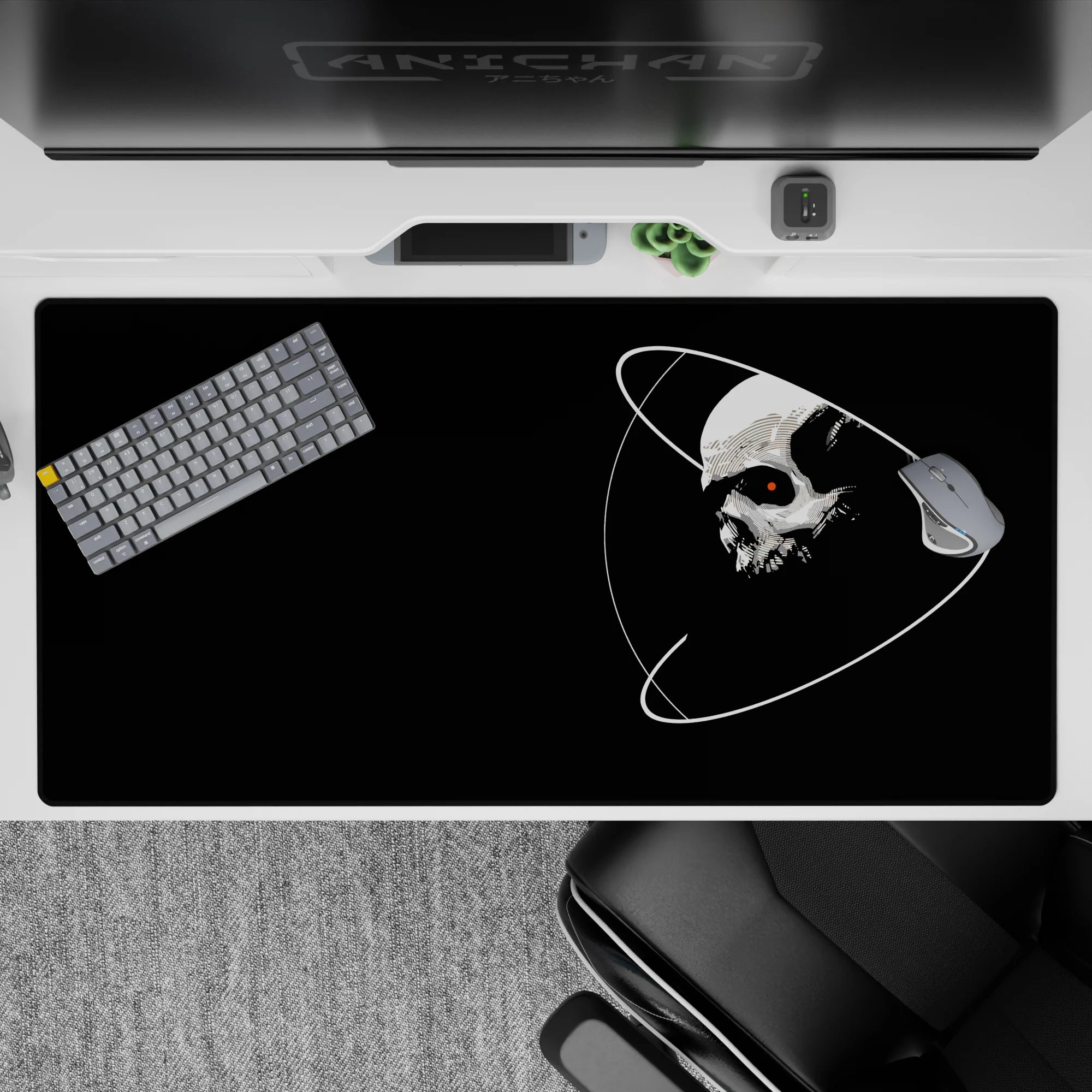 Midnight black desk pad 40x20 inches with clean white orbit lines and a tiny red eye, moody vibe.