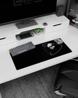 Floating skull in space with looping orbit rings and a red eye on a mouse pad, 28x12 inches.
