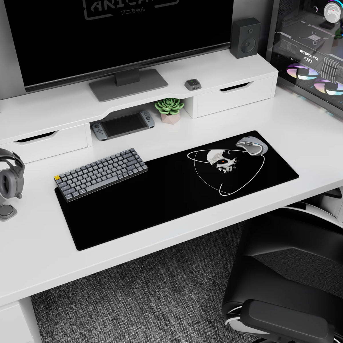 Stark skull with looping orbit rings and a tiny red eye mouse pad, 32x12 inches, bold space vibe.