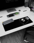 Stark skull with looping orbit rings and a tiny red eye mouse pad, 32x12 inches, bold space vibe.