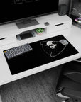 Floating skull with white orbital rings mouse pad, 32x16 inches, spooky space vibe.