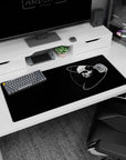 Stark skull with a tiny red eye floating in orbit rings on a 36x16 inches extended desk pad.