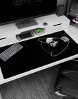 Floating skull scene with white orbital rings and red eye on desk pad, 40x20 inches, high contrast.