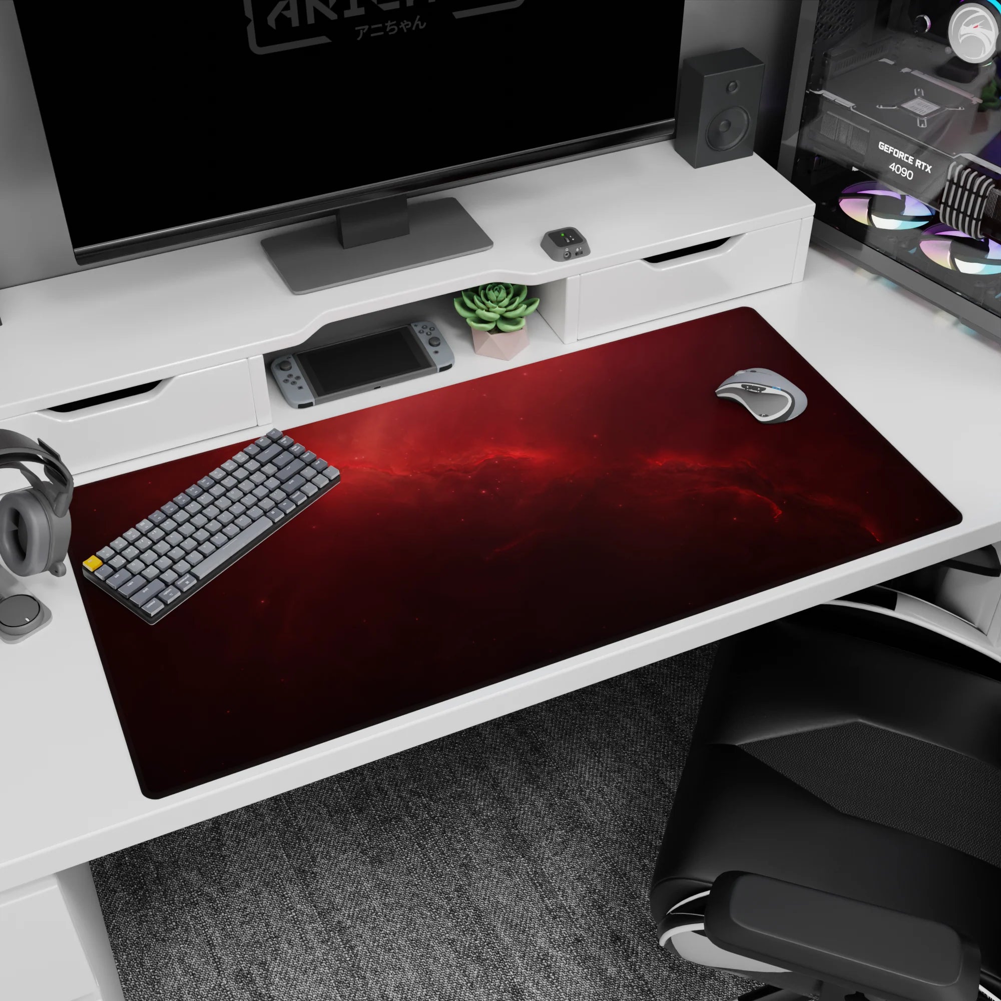 Star-speckled red nebula drifting across a desk pad, 40x20 inches, quiet night-sky scene in crimson.