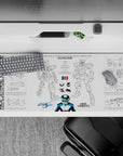 Blue and white sci-fi hangar vibe desk pad with crisp black linework, 36x16 inches.