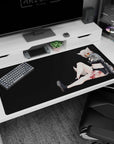 Fox-eared anime girl lounging pose desk pad 40x20 inches, amber shades, playful mischief on dark backdrop.