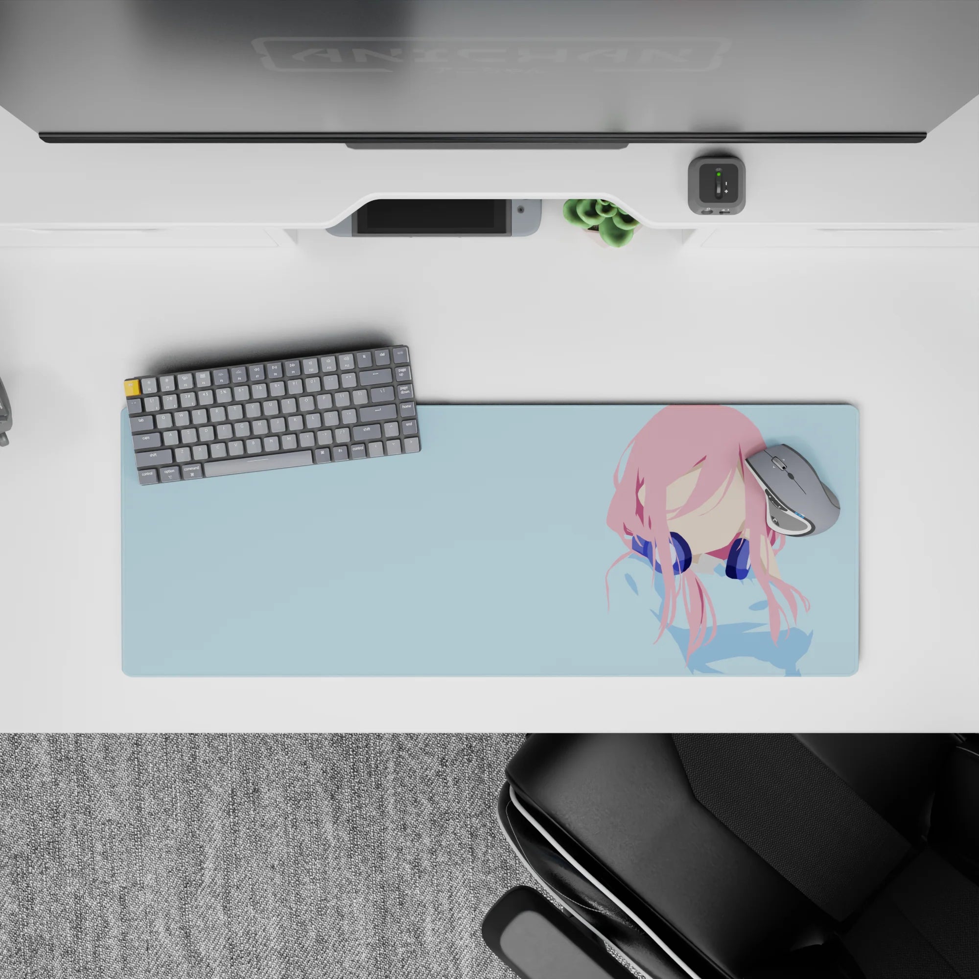 32x12 inches pastel anime desk mat in soft pink and sky blue, calm minimalist vibe with deep navy headphones.