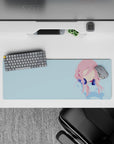 32x12 inches pastel anime desk mat in soft pink and sky blue, calm minimalist vibe with deep navy headphones.