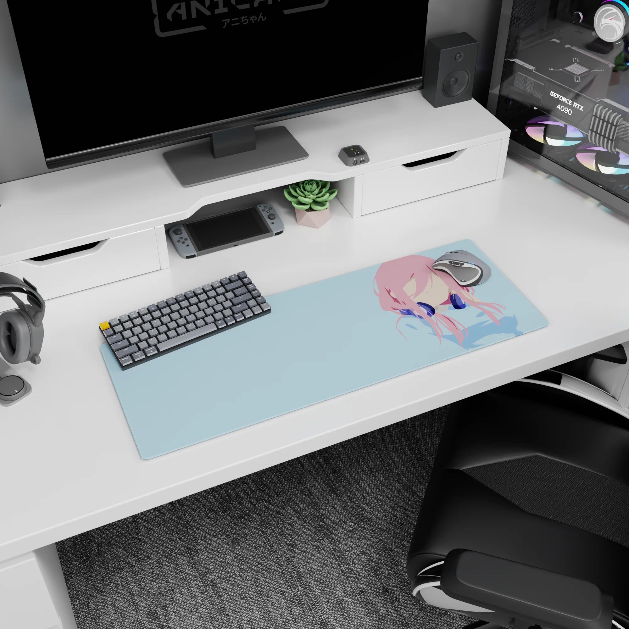 32x12 inches extended mouse pad showing a pink-haired anime girl in navy headphones, clean modern idol scene.