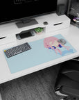 Faceless pink-haired anime girl wearing deep navy headphones on blue background mouse pad 32x16 inches.