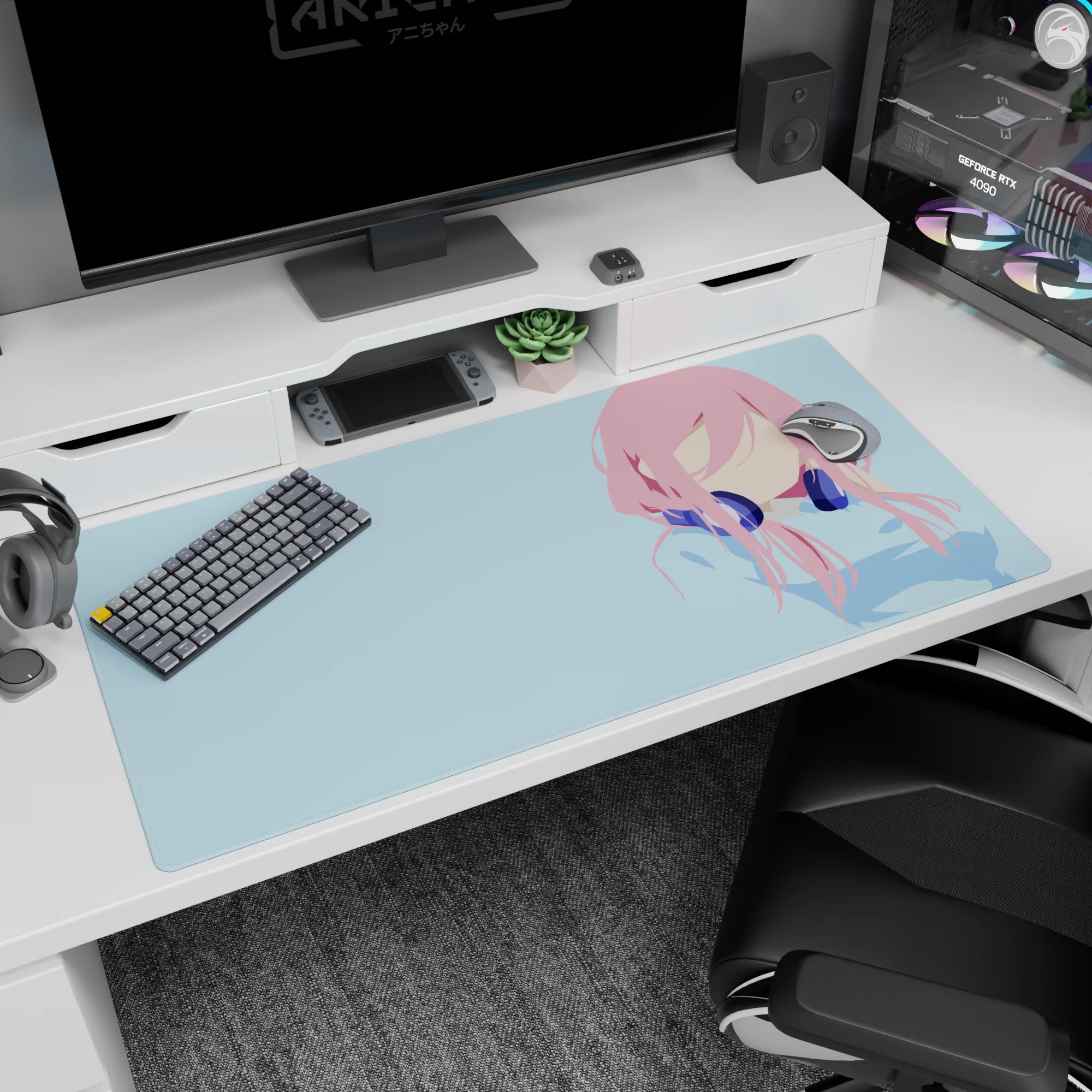 40x20 inches desk pad showing a pink-haired anime girl with navy headphones, minimal lines, blue backdrop.
