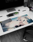 Anime girl with pale blue eyes, cat ears, and flowing ribbons before a clocktower skyline desk pad 36x16 inches.