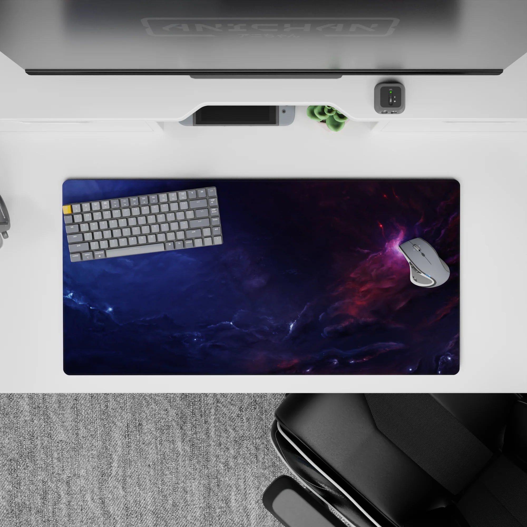 Moody 32x16 inches mouse pad in deep navy and smoky purple with cozy pink nebula light.