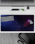 Moody 32x16 inches mouse pad in deep navy and smoky purple with cozy pink nebula light.