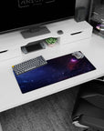 Sleepy galaxy scene mouse pad 28x12 inches featuring a pink nebula tucked in a stormy cloud corner.