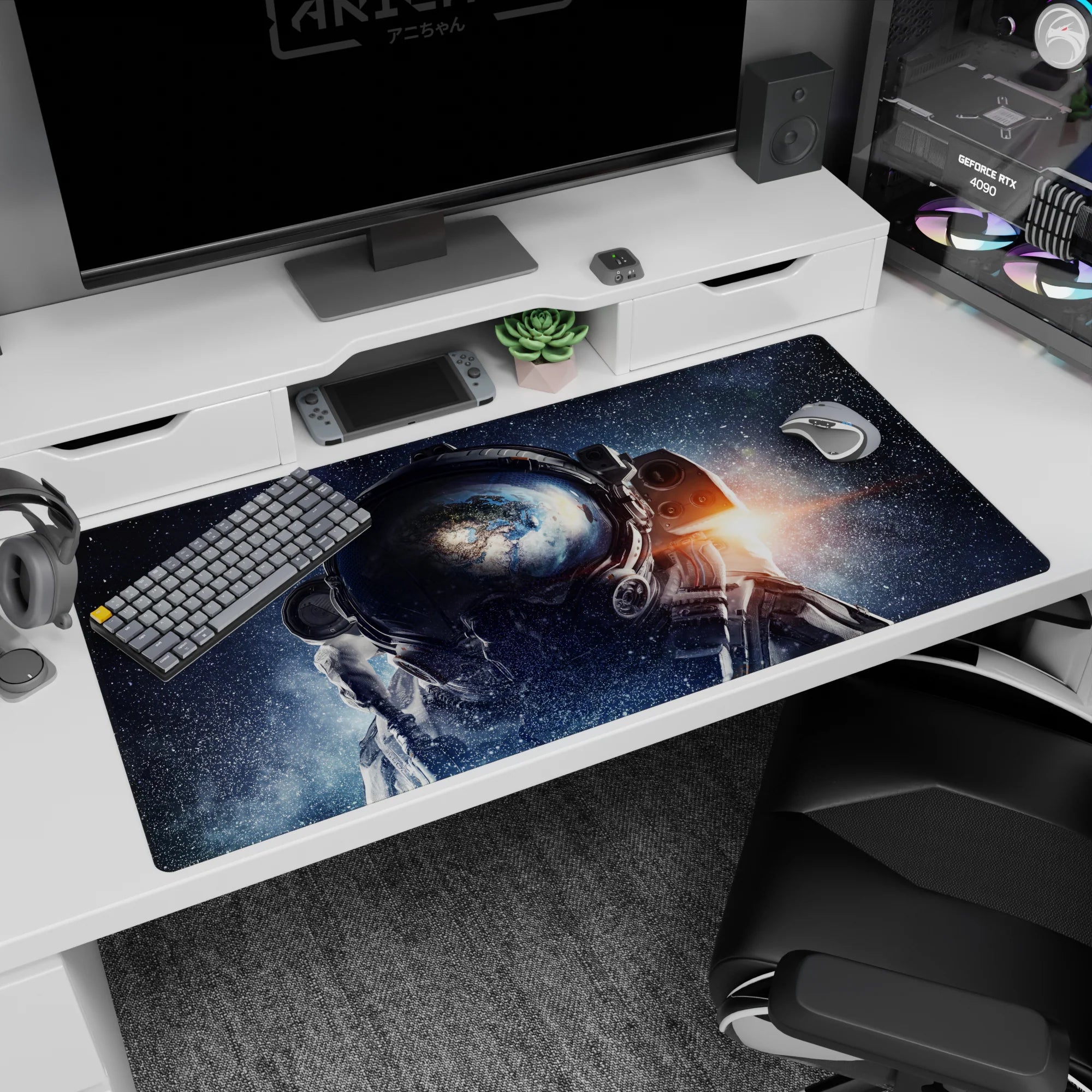 Bold astronaut helmet scene desk pad 40x20 inches set against deep space stars and drifting galaxy specks.