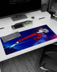 Short-haired anime warrior twisting mid-strike on desk pad 36x16 inches, red jacket flaring, blade flashing.