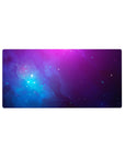 Galaxy vibe desk mouse pad, 32x16 inches, with cloud swirls and tiny star specks for smooth tracking.