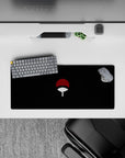 28x12 inches dark anime mouse pad in deep black with red-and-white fan, quiet intense Sasuke vibe.