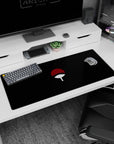 Sasuke Uchiha vibe desk pad with floating Uchiha fan emblem on black, 36x16 inches.