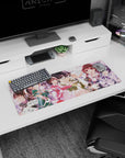 32x12 inches anime girl mouse pad featuring a bespectacled lead girl in a caught-in-the-moment pose.
