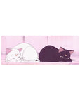 Anime mouse pad 32x12 inches with two moon-marked cats lounging in a soft pink room and glowing curtains.