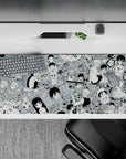 Mint gray anime desk pad 36x16 inches with bold black line art, chaotic-cute café comedy vibe.