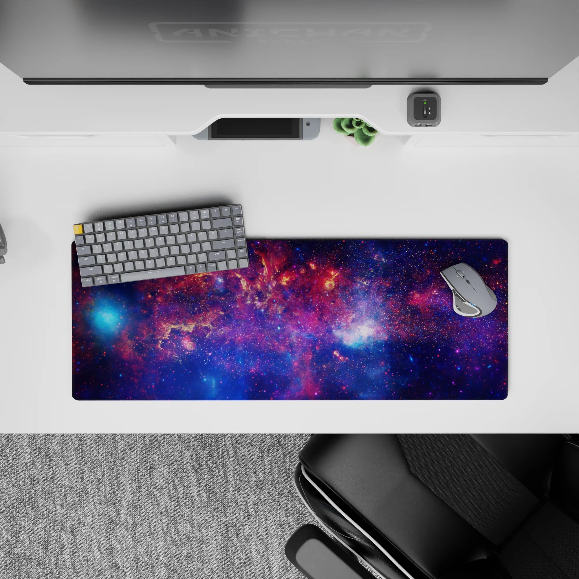 Cosmic mood mouse pad 32x12 inches in deep violet, midnight blue, and sparkly nebula pink.