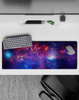 Cosmic mood mouse pad 32x12 inches in deep violet, midnight blue, and sparkly nebula pink.