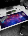 Star-sprinkled nebula scene desk pad with swirling cosmic clouds across the surface, 40x20 inches.