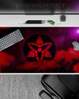 40x20 inches anime desk pad in bold reds and cosmic purples, moody shinobi-clan vibe for RGB gaming setups.