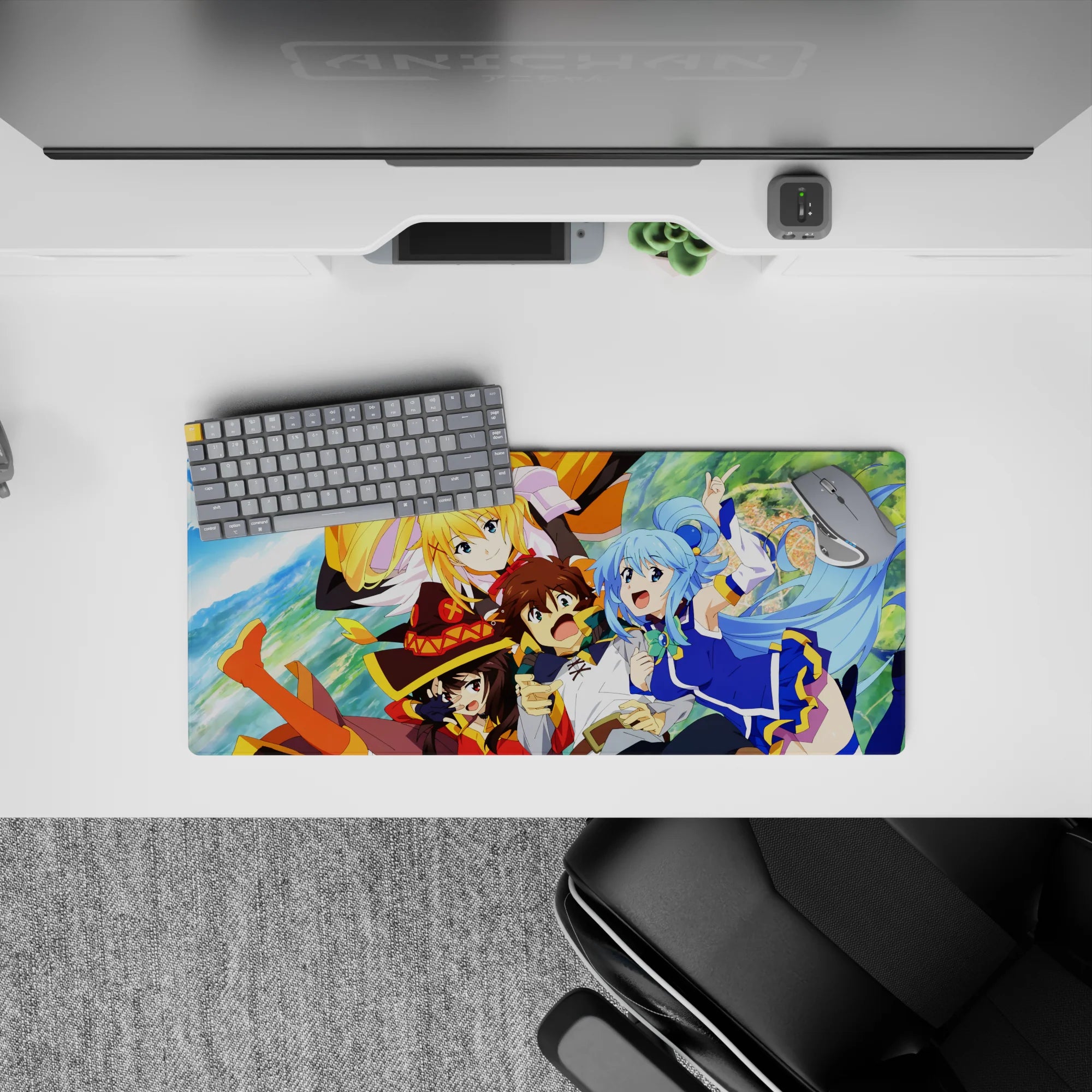 KonoSuba anime mouse pad 28x12 inches featuring Kazuma, Aqua, Darkness, and Megumin in a vibrant, chaotic scene.