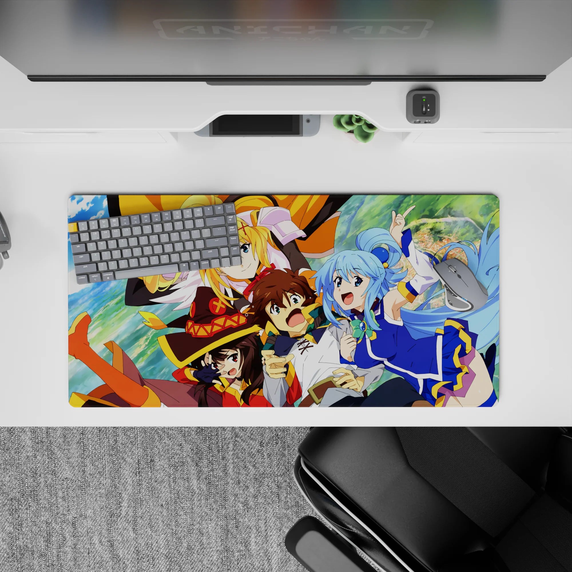 KonoSuba anime mouse pad 32x16 inches featuring Kazuma, Aqua, Darkness, and Megumin in a vivid, energetic scene.
