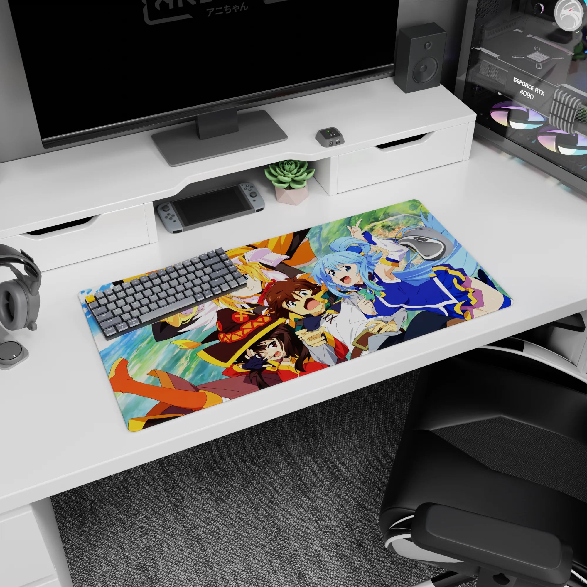 KonoSuba anime mouse pad 32x16 inches featuring Kazuma, Aqua, Darkness, and Megumin in a vibrant, chaotic scene.