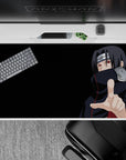 Dark black 40x20 inches anime desk pad with red Akatsuki accents and intense Sharingan eyes mood.