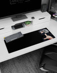 Itachi Uchiha reaching out on a 32x12 inches anime mouse pad, calm stare and glowing Sharingan eyes.