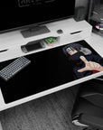 Itachi Uchiha reaching out scene on a 40x20 inches anime desk pad, calm dangerous Naruto vibe.