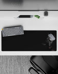 Moody charcoal anime girl mouse pad 32x12 inches with deep shadows and tiny red candy-like accents.