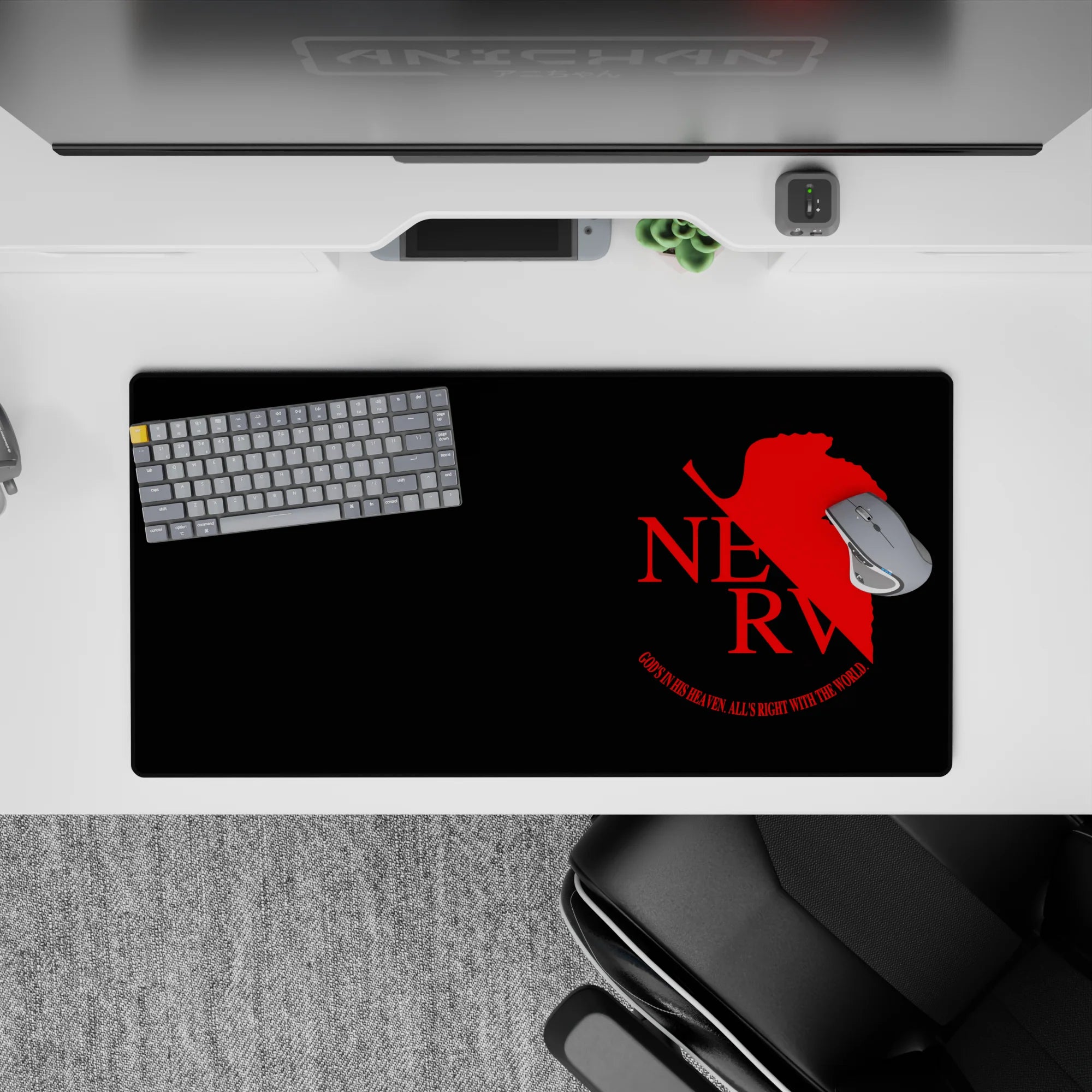 Anime mouse pad 32x16 inches featuring NERV insignia from Neon Genesis Evangelion, red on black with the phrase &quot;God’s in His Heaven, All’s Right with the World&quot;.