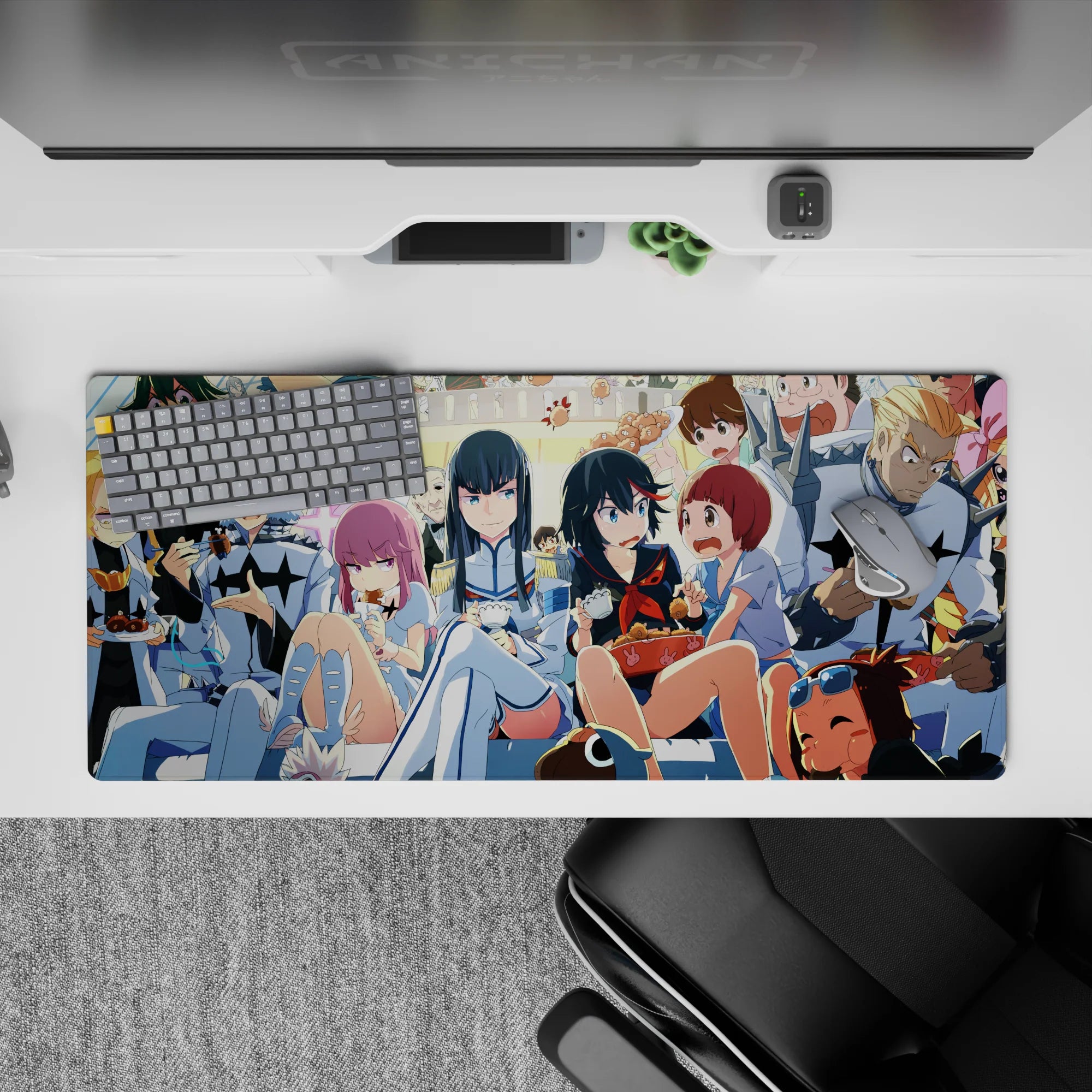36x16 inches neon-bright anime desk pad in blues, creams, candy reds; chaotic cozy snack-time vibe.